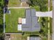 This aerial view showcases the entire property, including the expansive backyard, shed, and patio at 832 Wildwood Cir, Port Orange, FL 32127