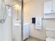 Bathroom with a white vanity, a walk-in shower, and decorative elements at 832 Wildwood Cir, Port Orange, FL 32127