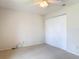 Bedroom with carpet, white walls, ceiling fan, and a closet with double doors at 832 Wildwood Cir, Port Orange, FL 32127