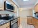 Beautiful kitchen features modern appliances and provides convenient open floor plan access at 832 Wildwood Cir, Port Orange, FL 32127