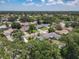 This aerial view highlights the property's location in a vibrant neighborhood, surrounded by lush greenery and mature trees at 832 Wildwood Cir, Port Orange, FL 32127