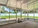 A screened patio offering a view of a fenced yard, grass, and a shed in the backyard at 832 Wildwood Cir, Port Orange, FL 32127