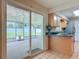 Enclosed patio with a view of the private backyard, accessible from the dining area at 832 Wildwood Cir, Port Orange, FL 32127