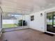 Screened-in patio providing an outdoor view and access to the backyard at 832 Wildwood Cir, Port Orange, FL 32127