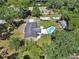 Overhead view capturing the home's pool, outbuilding, RV parking, and expansive yard at 851 W Wisconsin Ave, Orange City, FL 32763