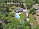 Aerial shot highlighting a pool, RV parking, spacious backyard, and peaceful surroundings at 851 W Wisconsin Ave, Orange City, FL 32763