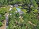 Scenic aerial view showcasing the home's pool, spacious yard, outbuilding, and RV parking at 851 W Wisconsin Ave, Orange City, FL 32763