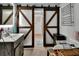 This bathroom showcases custom wood and frosted glass sliding doors, offering a unique design element at 851 W Wisconsin Ave, Orange City, FL 32763