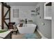 Stylish bathroom featuring a freestanding tub, modern fixtures, and elegant decor at 851 W Wisconsin Ave, Orange City, FL 32763