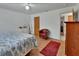Comfortable bedroom featuring hardwood floors and natural light at 851 W Wisconsin Ave, Orange City, FL 32763