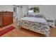 Bright bedroom featuring hardwood floors, barn door, and lots of natural light at 851 W Wisconsin Ave, Orange City, FL 32763