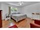 Comfortable bedroom featuring hardwood floors and natural light at 851 W Wisconsin Ave, Orange City, FL 32763