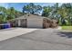 Charming single-story home with a brick exterior, attached garage, and well-maintained landscaping at 851 W Wisconsin Ave, Orange City, FL 32763