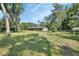 Charming brick home with a well-maintained lawn and mature trees, offering a peaceful setting at 851 W Wisconsin Ave, Orange City, FL 32763