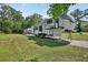 Exterior view of a Sandpiper RV parked on a grassy lot with a paved driveway at 851 W Wisconsin Ave, Orange City, FL 32763