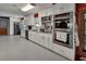 Modern kitchen featuring stainless steel appliances and a barn door accent at 851 W Wisconsin Ave, Orange City, FL 32763