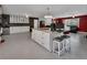 Large kitchen island with bar stools and plenty of storage, opening up to living spaces at 851 W Wisconsin Ave, Orange City, FL 32763