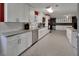 Bright kitchen with stainless steel appliances, granite countertops, and lots of storage at 851 W Wisconsin Ave, Orange City, FL 32763