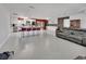 Open-concept kitchen with large island and bar seating, seamlessly connected to living area at 851 W Wisconsin Ave, Orange City, FL 32763
