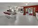 Bright, modern kitchen features an island, white cabinetry, and stainless steel appliances at 851 W Wisconsin Ave, Orange City, FL 32763