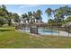 Private pool with a secure safety fence, backing onto a spacious, grassy yard at 851 W Wisconsin Ave, Orange City, FL 32763