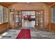 Charming sunroom with access to the main house, featuring wood paneling and lots of natural light at 851 W Wisconsin Ave, Orange City, FL 32763