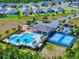 Aerial view features a community pool, covered pavilion, playground, and pickleball courts at 918 Noble Run, New Smyrna Beach, FL 32168