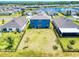 Expansive backyard with green lawn, black fencing, and serene neighborhood backdrop at 918 Noble Run, New Smyrna Beach, FL 32168