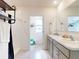 Bathroom featuring a double vanity, tile flooring, and a separate shower area with a modern shower head at 918 Noble Run, New Smyrna Beach, FL 32168
