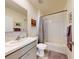 Well-lit bathroom featuring a shower-tub combination and neutral finishes for a clean and serene ambiance at 918 Noble Run, New Smyrna Beach, FL 32168