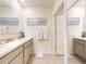 Bright bathroom features double vanity, tile floors, and an enclosed toilet area at 918 Noble Run, New Smyrna Beach, FL 32168