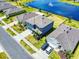 Beautiful two-story home with well-manicured lawn and a view of a tranquil pond at 918 Noble Run, New Smyrna Beach, FL 32168