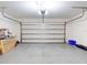 Clean, spacious garage with epoxy flooring, an automatic door, and ample room for storage at 918 Noble Run, New Smyrna Beach, FL 32168