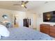 Spacious bedroom offering a ceiling fan, en suite bathroom and a walk in closet at 918 Noble Run, New Smyrna Beach, FL 32168