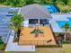 Aerial showcases community playground, pavilion, pool with lounge chairs, and parking at 918 Noble Run, New Smyrna Beach, FL 32168