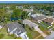 Aerial view of home in neighborhood with mature landscaping and pond at 929 N Lakewood Ter, Port Orange, FL 32127