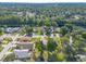 An aerial view showcases the community's lush green landscaping and river access, enhancing its appeal at 929 N Lakewood Ter, Port Orange, FL 32127
