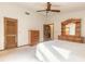 Well-lit bedroom showcasing light-colored carpet, wooden furniture, and a neutral wall color at 929 N Lakewood Ter, Port Orange, FL 32127