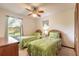 The bedroom features two twin beds, a window view, ceiling fan and closet space at 929 N Lakewood Ter, Port Orange, FL 32127