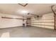 An empty garage with concrete floors, utility hook ups, and an automatic garage door opener at 929 N Lakewood Ter, Port Orange, FL 32127