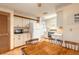 Traditional eat-in kitchen features white cabinets, tile floors and white appliances at 929 N Lakewood Ter, Port Orange, FL 32127