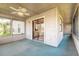 Screened-in porch with a ceiling fan, screened windows, and a sliding glass door at 929 N Lakewood Ter, Port Orange, FL 32127