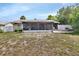 Backyard features a large, screened in patio and white privacy fence at 953 Tulip St, Deltona, FL 32725