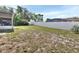 Spacious backyard features a white privacy fence, partially grassy area, and room for activities at 953 Tulip St, Deltona, FL 32725