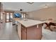 Open kitchen with a central island flowing into dining and living areas for easy entertaining and comfortable living at 953 Tulip St, Deltona, FL 32725