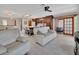 Bright, open-concept living space with modern white tile flooring and seamless flow to the kitchen area at 953 Tulip St, Deltona, FL 32725