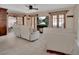 Bright and airy living room featuring tile floors, neutral tones, and a decorative fireplace focal point for cozy living at 953 Tulip St, Deltona, FL 32725