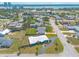 Beautiful aerial view of the home surrounded by lush landscaping, close to the inter-coastal waterway at 1032 Bel Aire Dr, Daytona Beach, FL 32118