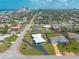 Panoramic aerial view captures the home's proximity to the beach and city skyline, with lush greenery at 1032 Bel Aire Dr, Daytona Beach, FL 32118