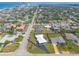 Picturesque aerial view highlights the home’s location, nestled between the beach and cityscape, near the water at 1032 Bel Aire Dr, Daytona Beach, FL 32118